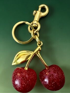 Cherry Bag Charms or Keychains NWOT. Gold bag charm with pink glitter cherries.